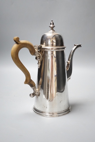 A 1970's 18th century style silver coffee pot, Bryan Savage, London, 1973, 24.5cm, gross 25oz.